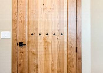 How Should Custom Wood Door Details Change Between Modern and Transitional Homes?